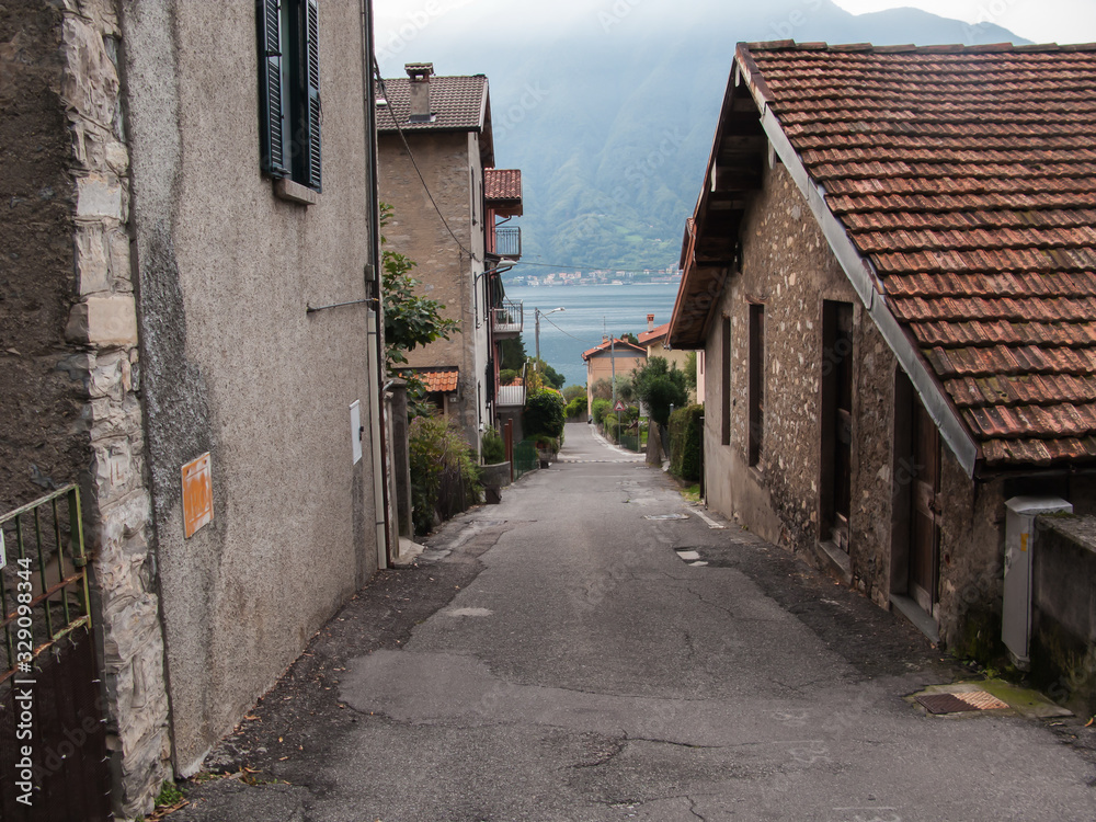 narrow steep street in Ossuccio, lake Сomo, Tremezzina, Italy