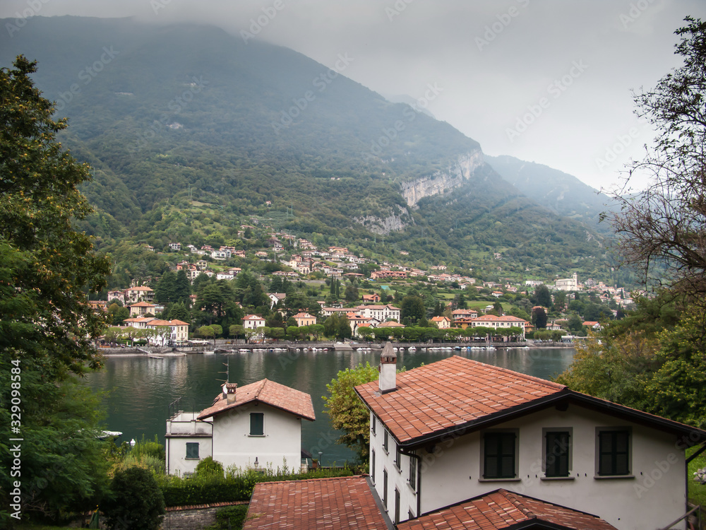 view of lake como, mountains and cloudy sky from Sacred Mount of Ossuccio, Our Lady of Help Sanctuary, lake Сomo, Tremezzina, Italy