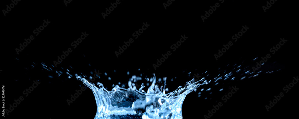 Water splash and drops isolated on black background.
