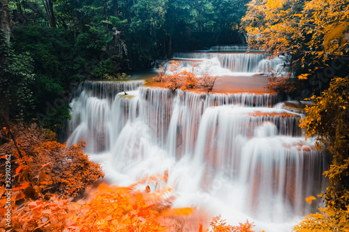 Exotic colorful Huay Mae Kamin waterfall in autumn forest natural world heritage and famous travel destination. Kanchanaburi province, Thailand.