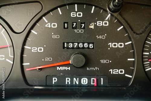 Fuel gauge, vehicle engine temperature, Miles Per Hour Speed indicator, and revolutions per minute indicator on a vehicle dashboard photo