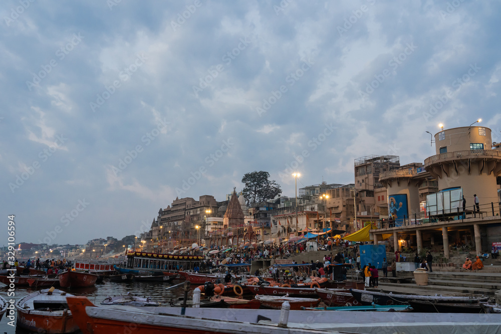 VARANASI, INDIA, FEBRUARY 27 2018: The Varanasi city beside the genga river with boat for traveller cruising view the river in the moring , Varanasi, India on February 27,2018.