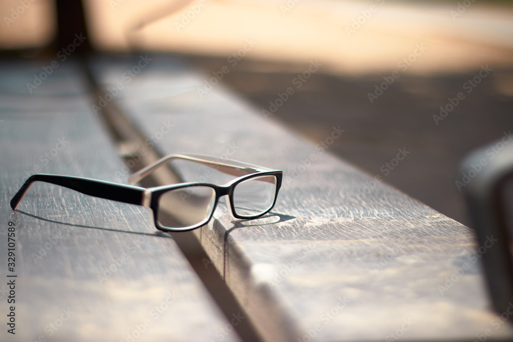  Glasses resting on a bench