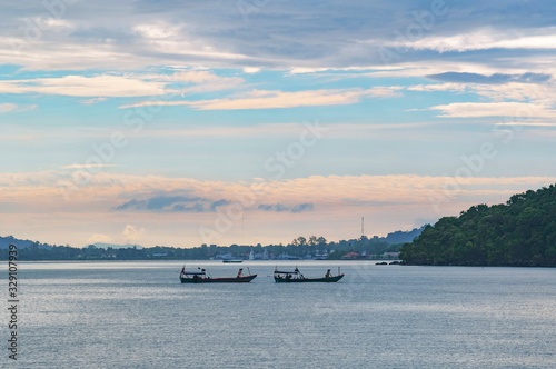Fishing boat on a background of clouds 