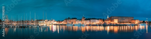 Stockholm, Sweden. Scenic Famous View Of Embankment In Old Town Of Stockholm In Night Lights. Gamla Stan, Great Church And Royal Palace. Popular Destination Scenic Place In Lights. Panorama