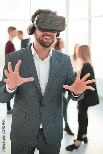 close up. a young businessman in a virtual reality helmet.