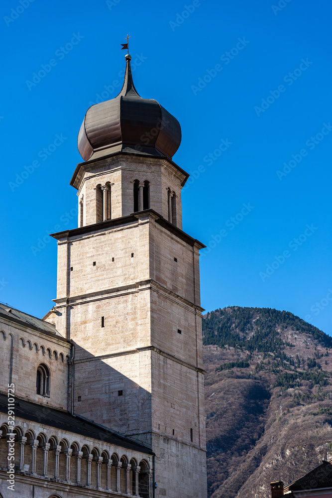 Closeup of the San Vigilio Cathedral (Duomo di Trento, 1212-1321) with the bell tower. In the background the Alps in winter, Trento, Trentino-Alto Adige, Italy, Europe