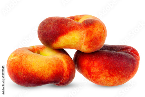 Flat peaches, close-up on a white background.