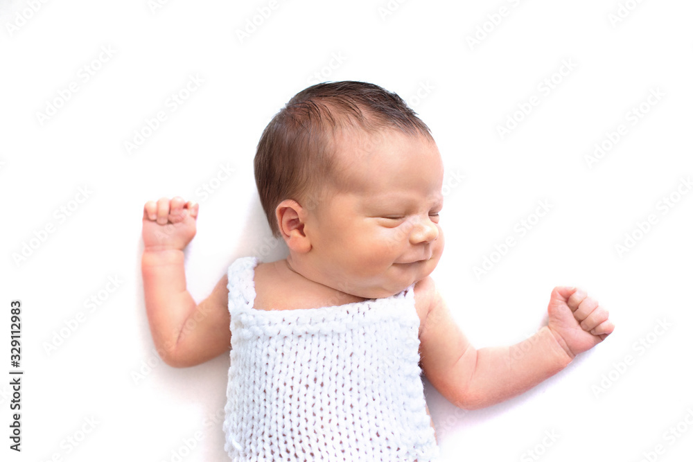 Newborn baby emotions, white background. Funny face of a child, emotions. Newborn baby emotions, white background. Funny face of a child, emotions.