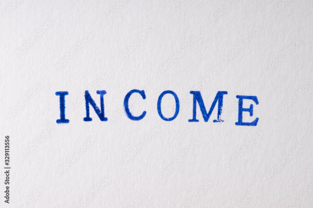 a income word stamped on a piece of paper. a income word stamped on a piece of paper.