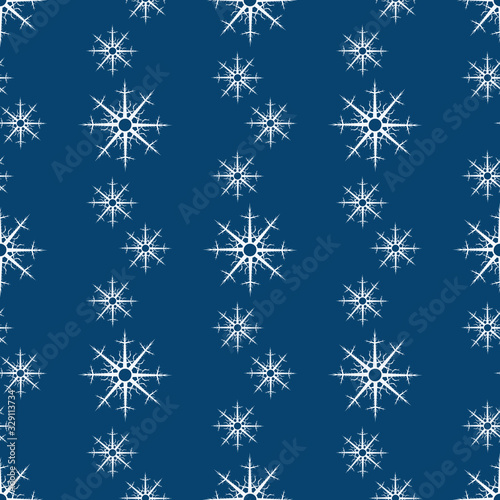 Seamless pattern with white snowflakes on dark blue background for plaid, fabric, textile, clothes, tablecloth and other things. Vector image.