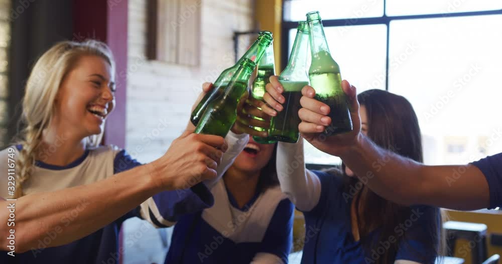 Friends at the bar in a pub having fun