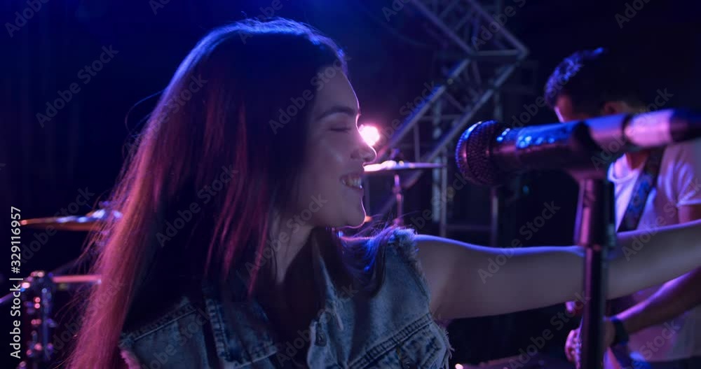 Female musician singing during a concert