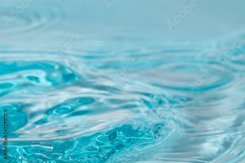 Abstract close up blue water background.Water surface wallpaper.