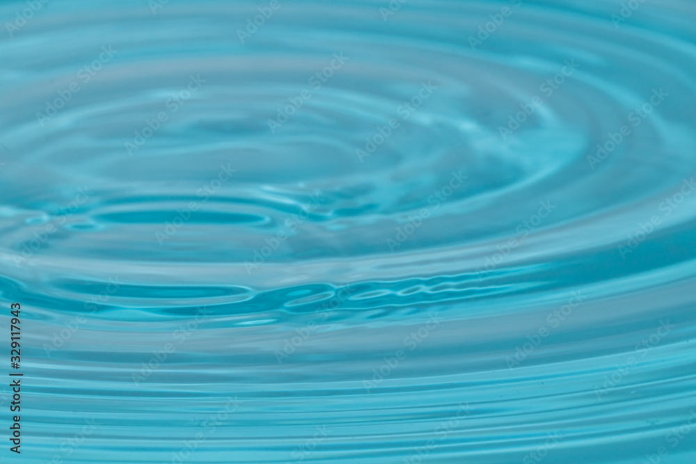 Abstract close up blue water background.Water surface wallpaper.