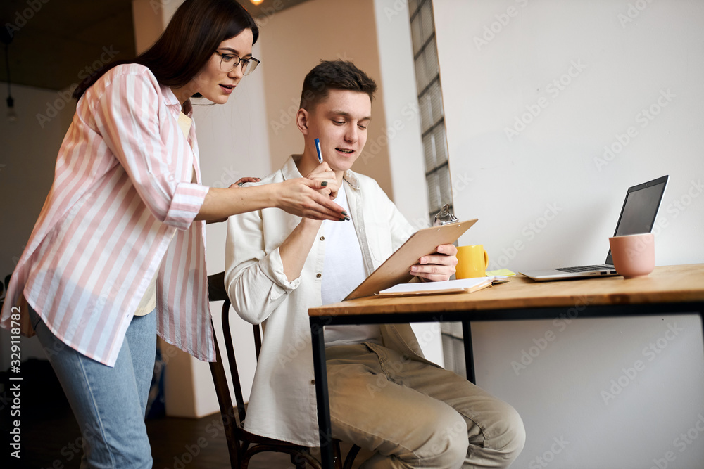 it's piece of cake, woman teaching a man to save money, planning the day, management skills, close up photo. girl in glasses showing man's mistakes.corrections. family designing their new house, flat it's piece of cake, woman teaching a man to save money, planning the day, management skills, close up photo. girl in glasses showing man's mistakes.corrections. family designing their new house, flat