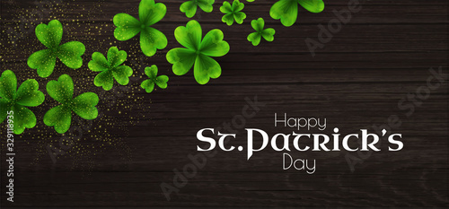 St Patricks Day background with shamrock, lucky clover leaves and wood texture.