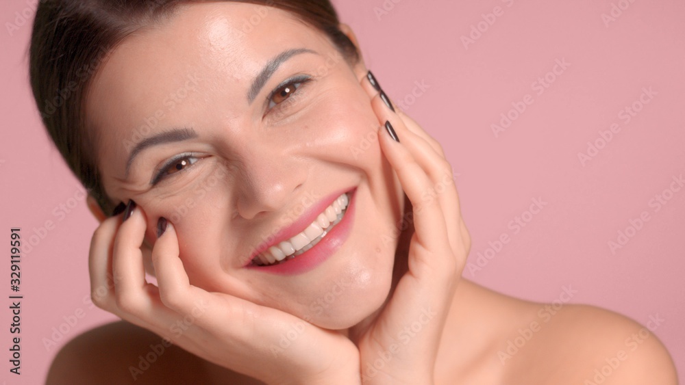 Healthy glowing skin. Self-care concept portrait of adult woman with skeen in good conditions after facial treatments Healthy glowing skin. Self-care concept portrait of adult woman with skeen in good conditions after facial treatments