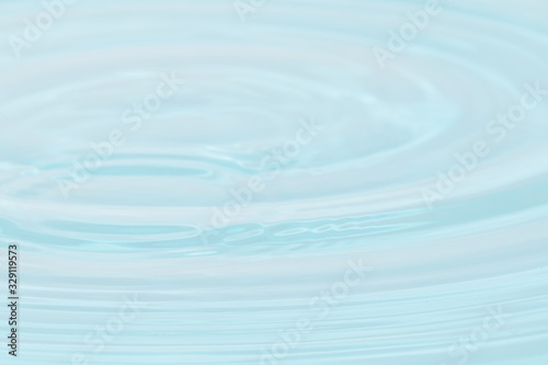Abstract close up blue water background.Blurred water surface.
