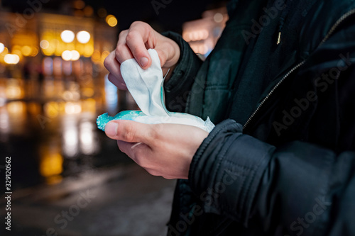 Man using wet wipes to clean his hands, hygiene concept , virus protection  