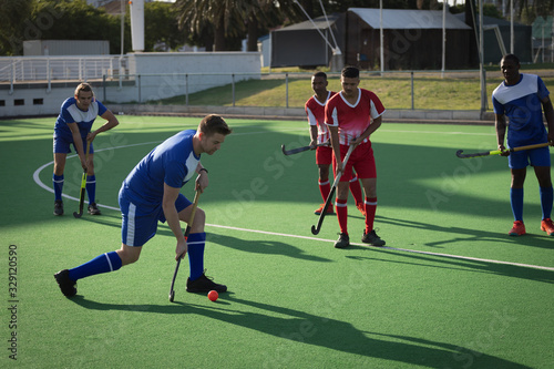 Field hockey players playing hockey