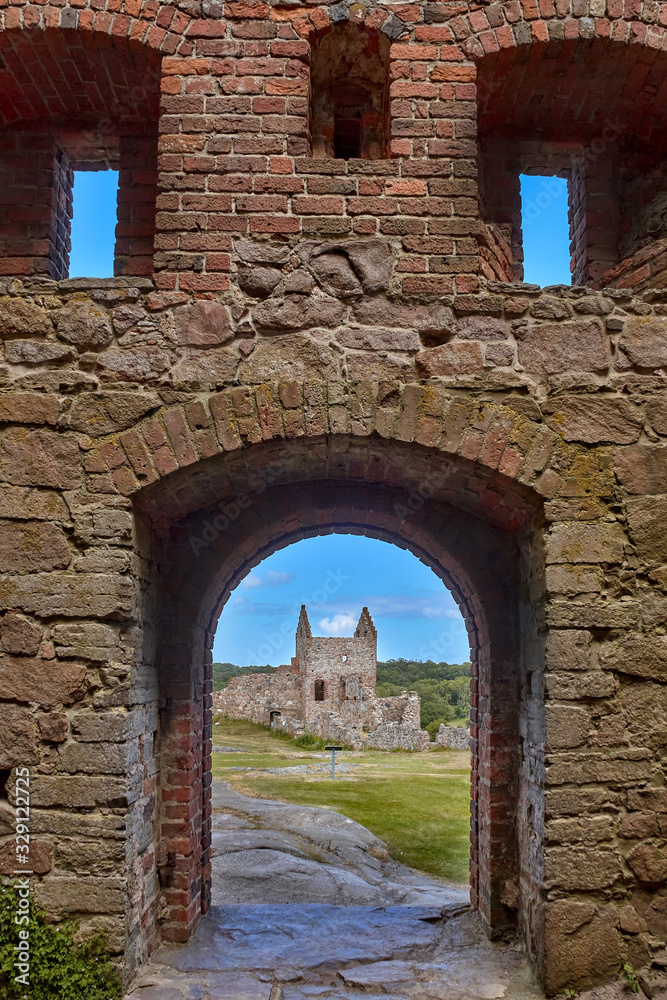 Ruins of Blommetarnet tower seen through doorway of Mantel tower in Hammershus castle - Scandinavia's largest medieval fortification.