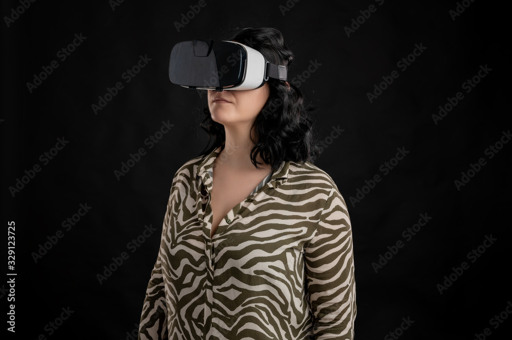Attractive young woman dressed casually with VR glasses, virtual reality Attractive young woman dressed casually with VR glasses, virtual reality