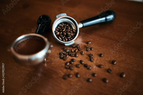 portafiler with fresh beans of coffee, close up photo. blurred image.good morning