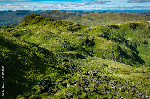 Lush green Scottish hills in summer, view from Meall nan Tarmachan, Perthshire, Scotland. photo
