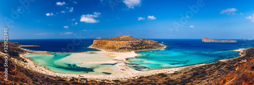 Fantastic panorama of Balos Lagoon and Gramvousa island on Crete, Greece. Cap tigani in the center. Balos beach on Crete island, Greece. Tourists relax and bath in crystal clear water of Balos beach.