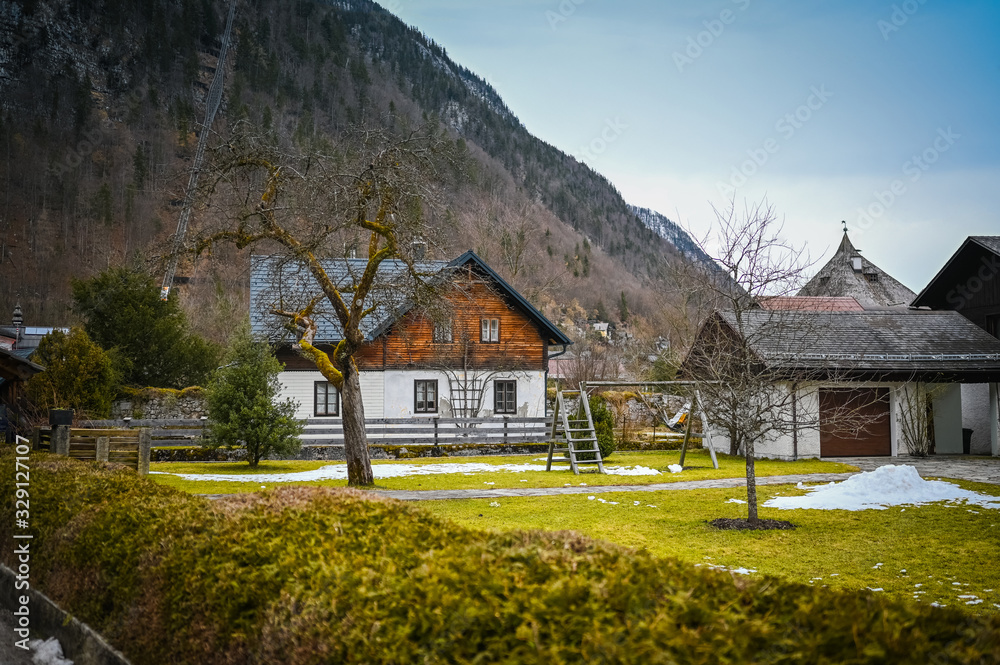 Famous Hallstatt mountain village and alpine lake landscape panorama, Austrian Alps, Austria. Landmark with traditional wooden houses. Unesco. Salzkammergut region. Travel and tourism concept