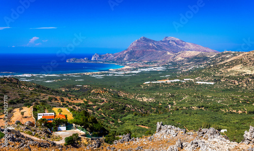 Fototapeta Naklejka Na Ścianę i Meble -  Shot of beautiful turquoise beach Falasarna (Falassarna) in Crete, Greece. View of famous paradise sandy deep turquoise beach of Falasarna (Phalasarna) in North West, Crete island, Greece.