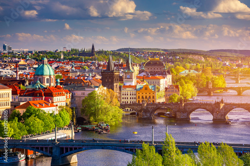 Photography Scenic view of the Old Town pier architecture and Charles Bridge over Vltava river in Prague, Czech Republic
