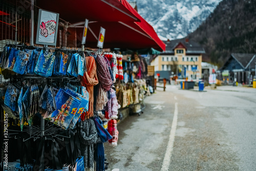 Souvenir shop with traditional postcards, magnets, bags, scarves, socks at the historic area of the mountain village Hallstatt. Austria. Unesco. Salzkammergut region. Travel and touristic concept © Алина Троева