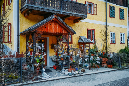 Souvenir shop at the historic area of the mountain village Hallstatt with traditional colorful wooden houses in Halshtati. Austria. Unesco. Salzkammergut region.