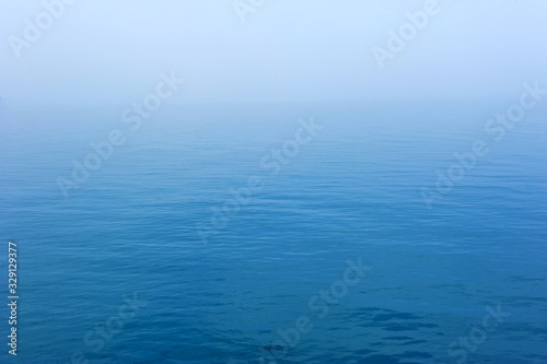 Vast blue sea with the mist background