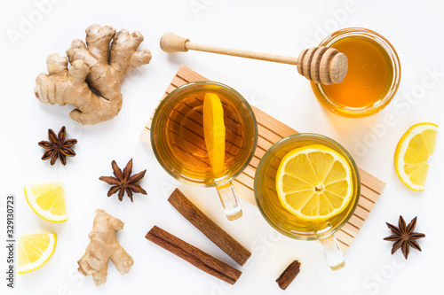 Tea with ginger, honey, lemon, cinnamon, anise on white background. Isolated. Flat lay, top view