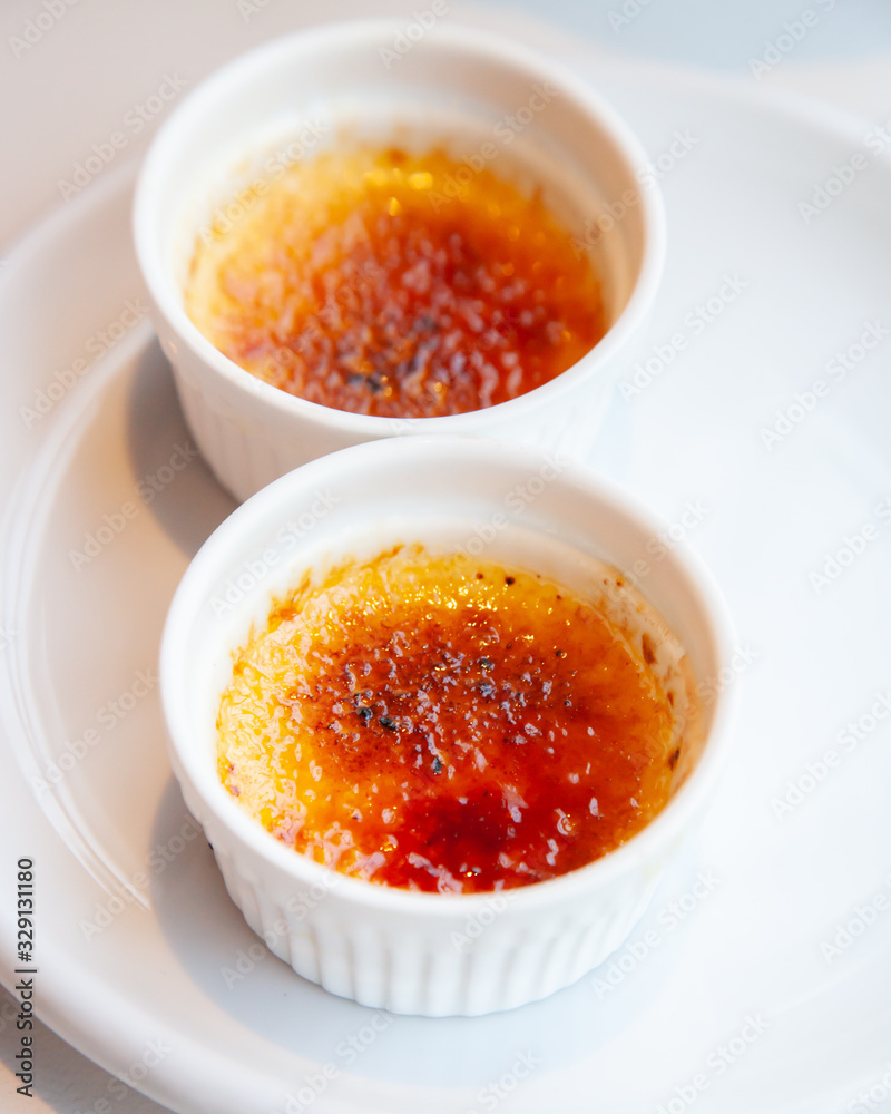 Traditional French creme brulee dessert with caramelized sugar on top Traditional French creme brulee dessert with caramelized sugar on top