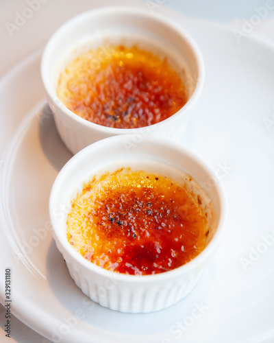 Traditional French creme brulee dessert with caramelized sugar on top