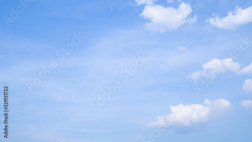 A blue sky with beautiful wisp of cloud for use as a backing or backdrop.