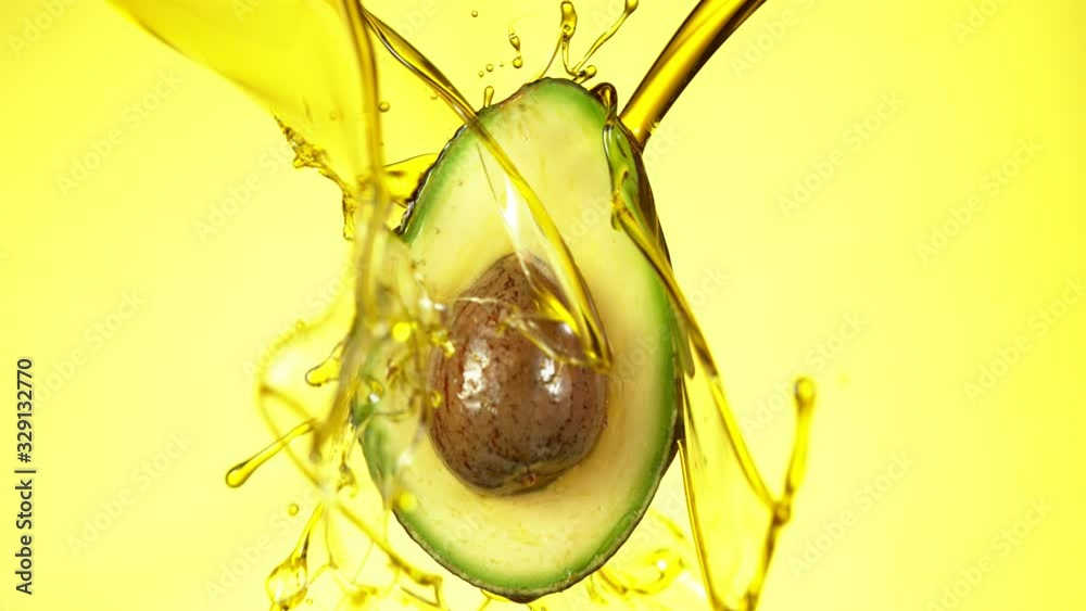 Super slow motion of splashing oil on avocado slice. Filmed on high speed cinema camera.