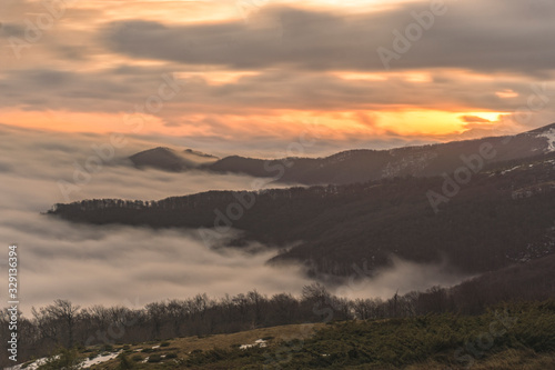 Foggy mountains at sunrise at long exposure