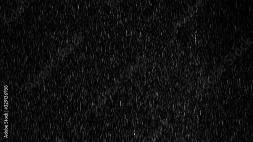 Medium heavy droplets of rain, falling on an isolated background 