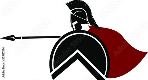 Spartan in a helmet and a red cloak. The warrior from Sparta boldly attacks with a spear and defends himself with a round shield. Black silhouette of a soldier’s figure on a white background.