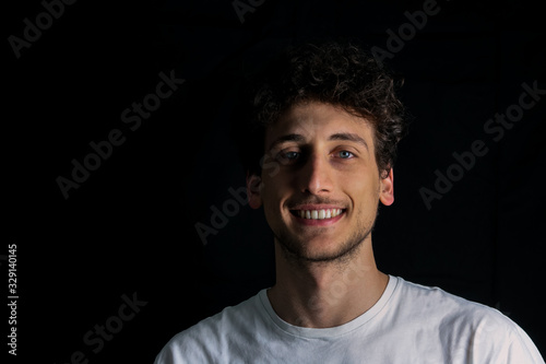 portrait of smiling guy in white shirt © raffaellagalvani