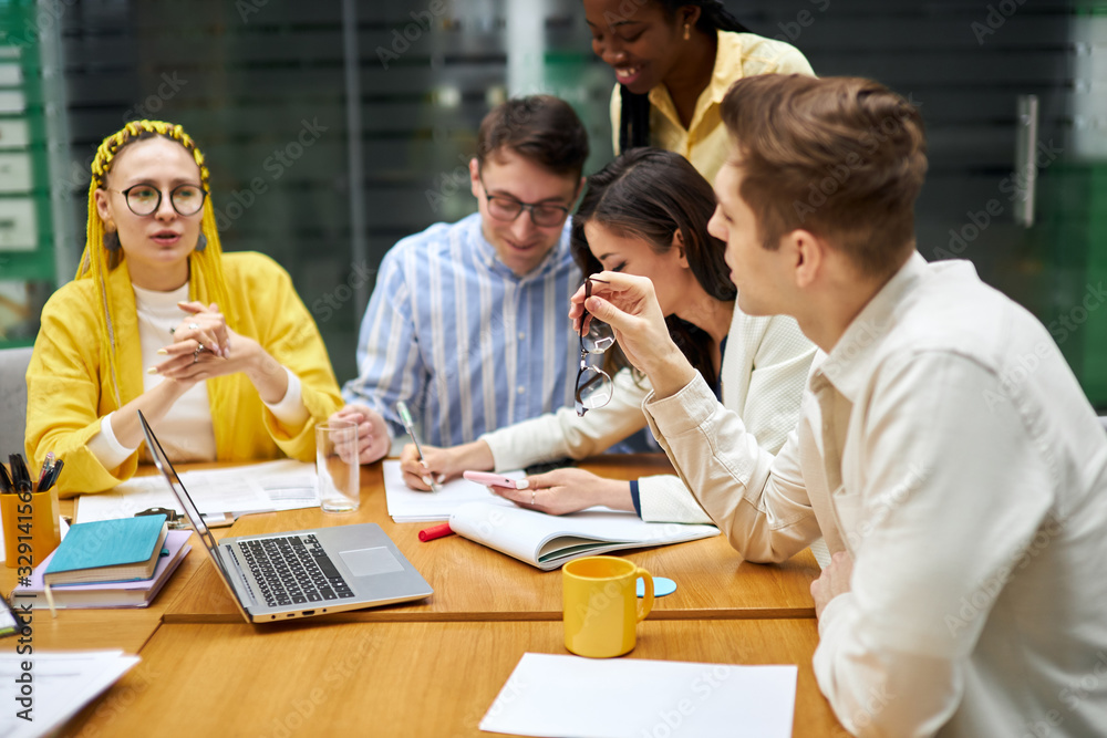hardworking team trying to reach goals together, togetherness, close up photo. young people concentrated on working process hardworking team trying to reach goals together, togetherness, close up photo. young people concentrated on working process