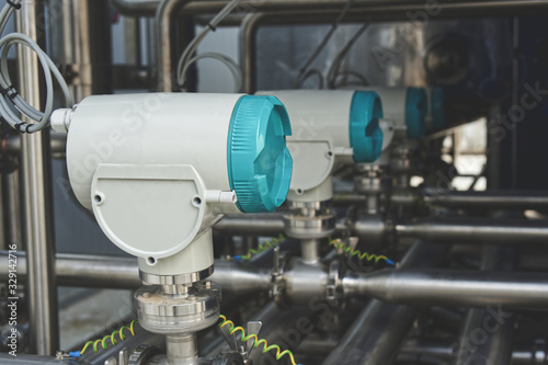 Measurement equipment installed on stainless steel pipes in industrial systems