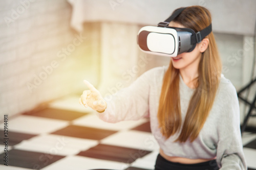 Woman are playing and working the virtual reality eye glass, the future multimedia connection the mobile or comupter good technology in the future  photo