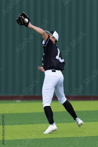 Photography Young boys playing in high school baseball game
