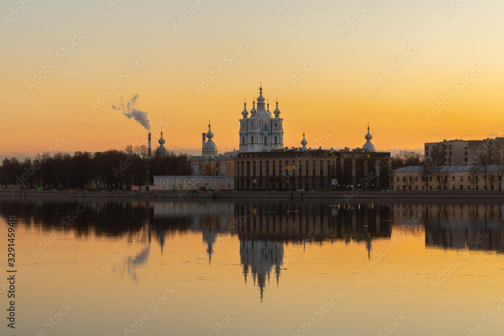 Smolny Cathedral at sunset. Saint Petersburg, Russia. View of the Neva river.